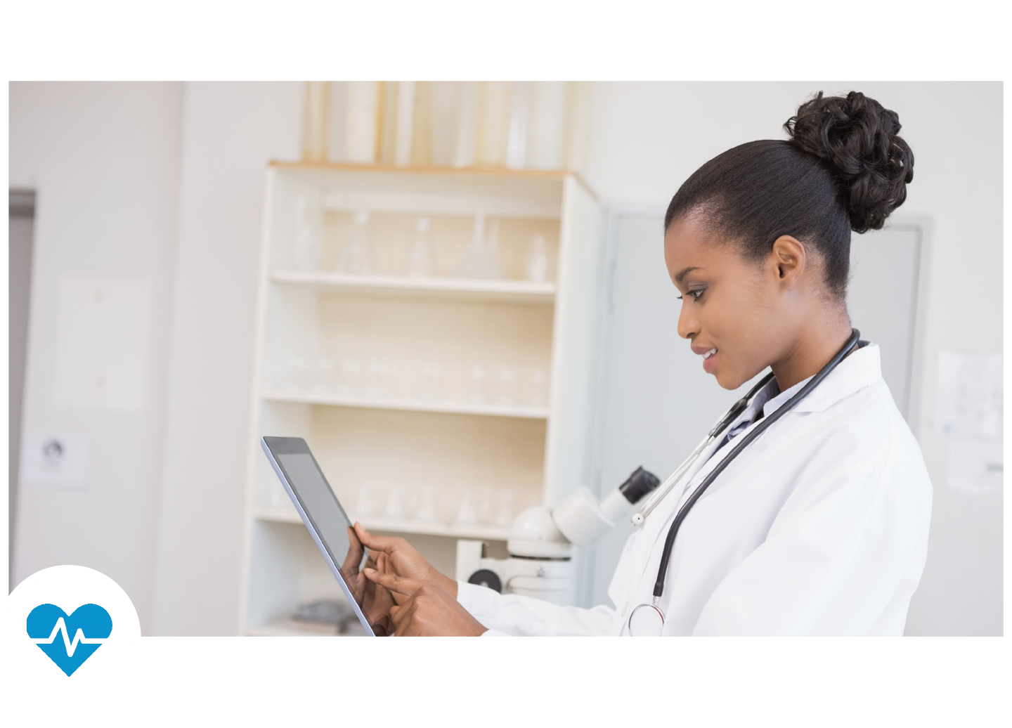 Healthcare Worker Holding Tablet in Doctor's Office