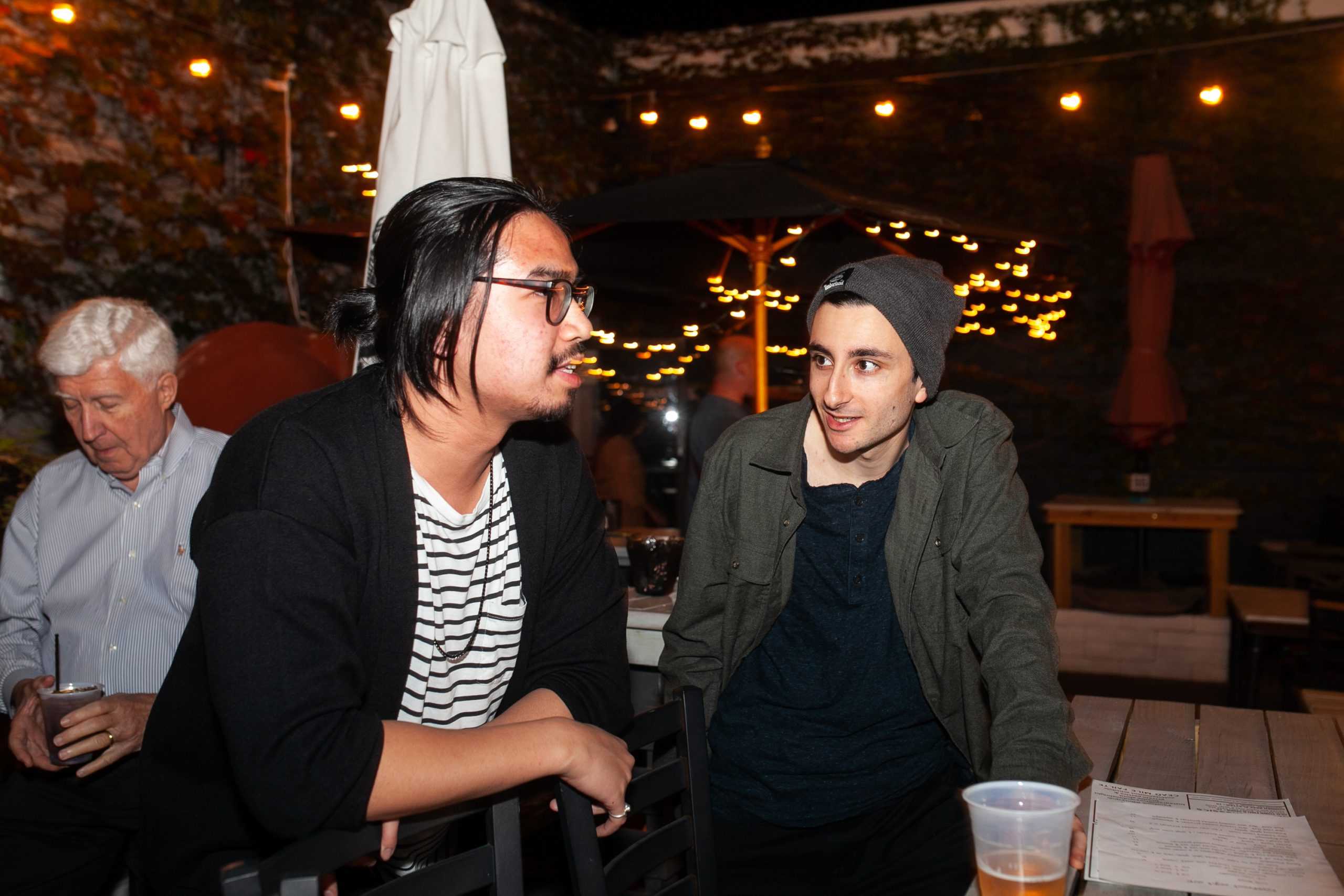 Two people at an event, in conversation.