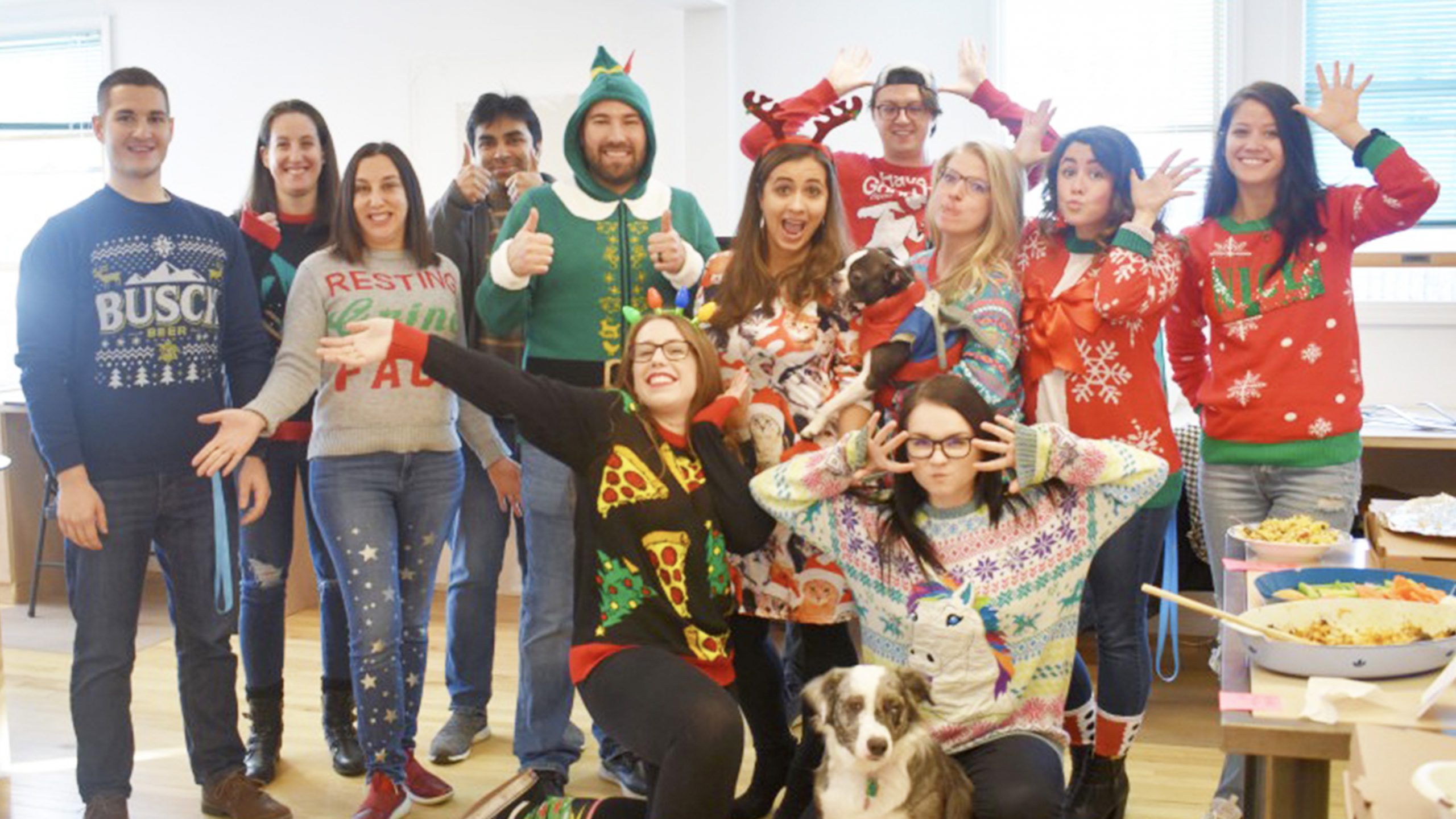 Silly Team photo, wearing holiday sweaters