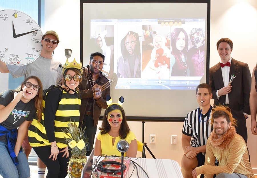 Careers_Photos_8_082719 Large A group photo during a Halloween costume contest, with people dressed as bumble bees, a referee, a lion, and other punny costumes.