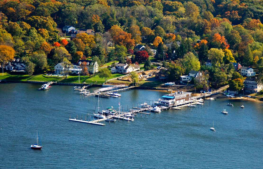 Fair_Haven_Drone Fair Haven aerial view of an ocean side community with a marina.