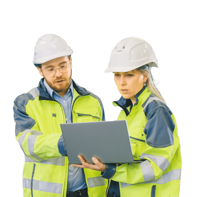 Mand and woman in construction looking at laptop